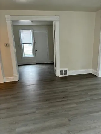a view of a livingroom with wooden floor