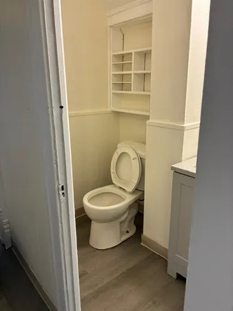 a bathroom with a toilet and a sink