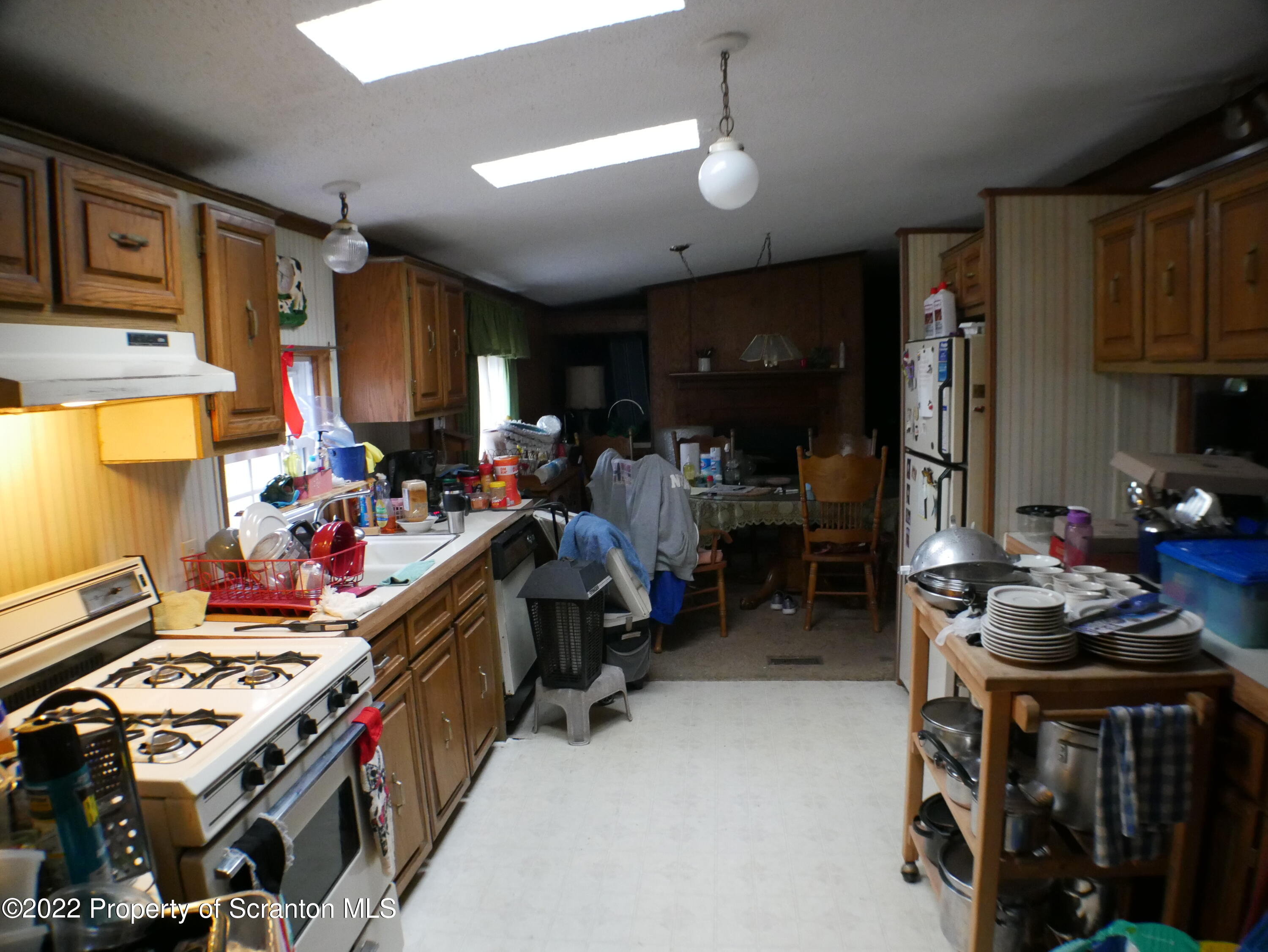991 Bennett Road Hop Bottom, PA 18824 - Photo 27 of 36 a room filled with furniture and a flat screen tv