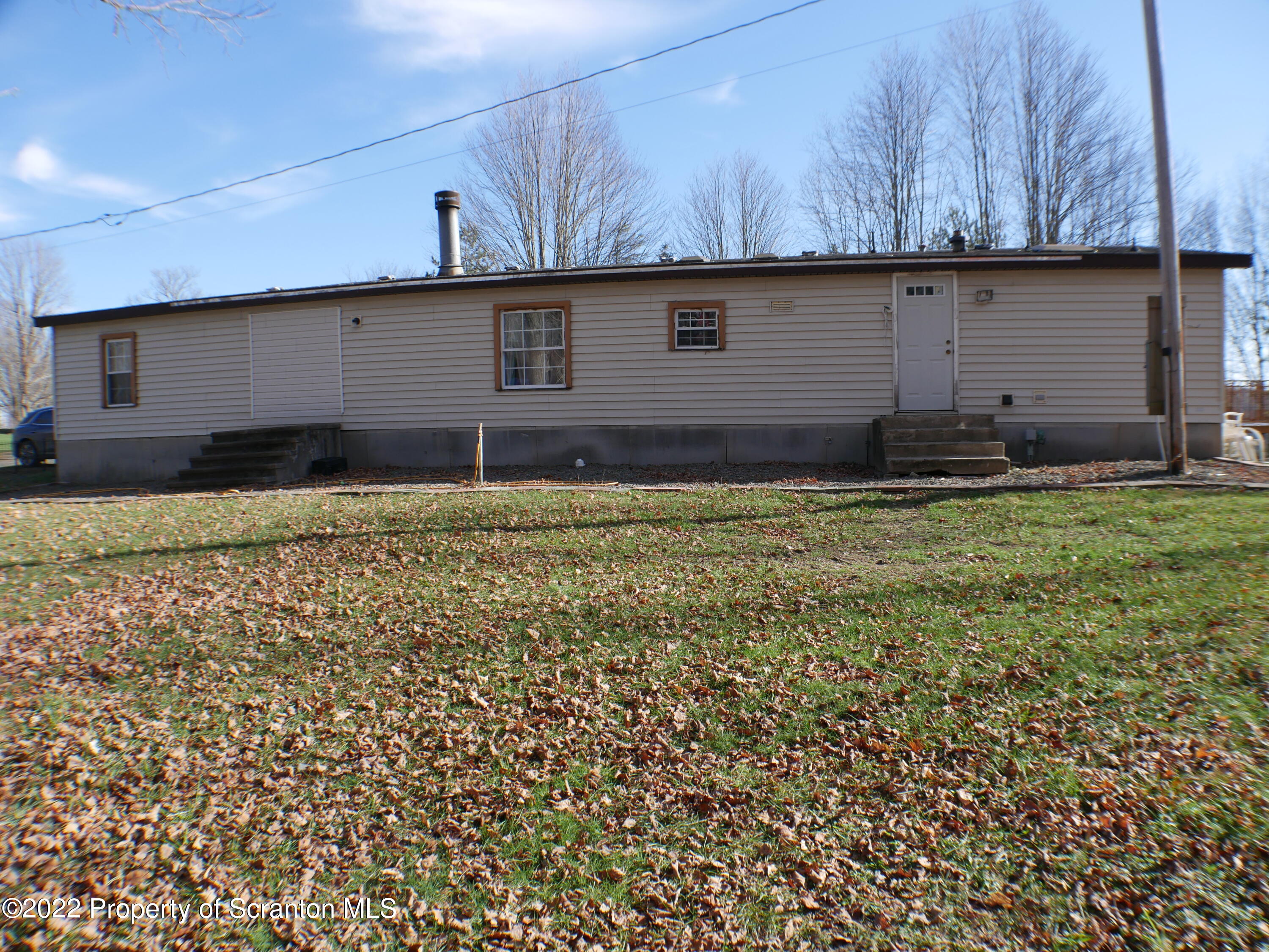 991 Bennett Road Hop Bottom, PA 18824 - Photo 31 of 36 a view of a back yard of the house