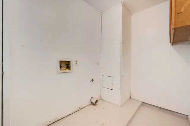 a view of a room with white wall