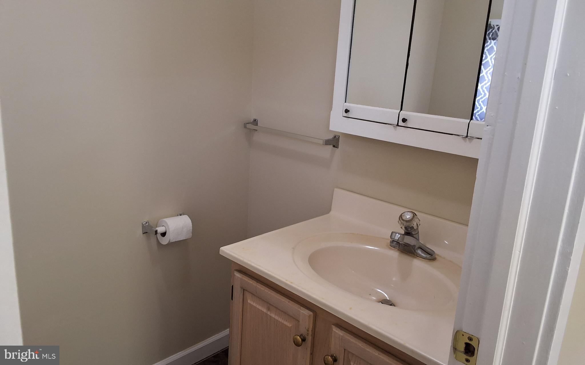 59 West Slokom Avenue Christiana, PA 17509 - Photo 10 of 28 a bathroom with a sink and cabinets
