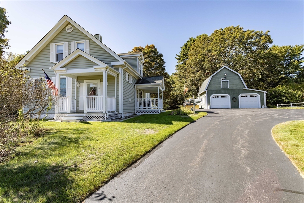 643 Center Street Raynham, MA 02767 - Photo 1 of 42 a front view of a house with garden
