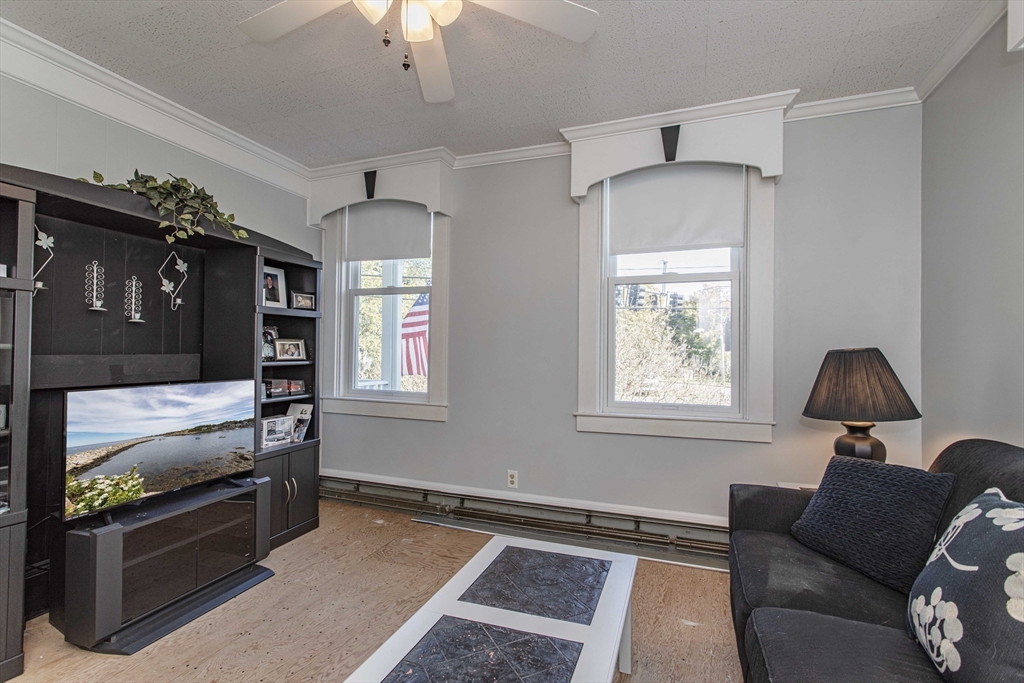 643 Center Street Raynham, MA 02767 - Photo 11 of 42 a living room with furniture and a window