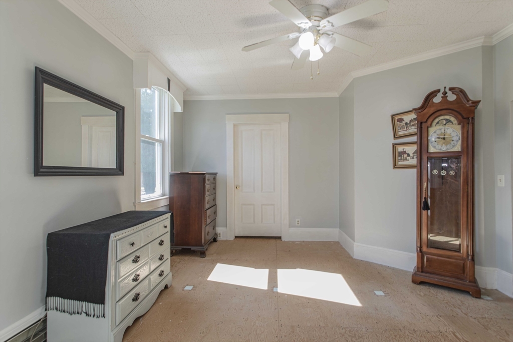 643 Center Street Raynham, MA 02767 - Photo 13 of 42 a view of a bedroom with closet area