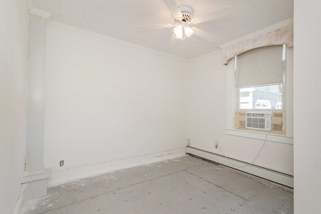 643 Center Street Raynham, MA 02767 - Photo 15 of 42 an empty room with a window