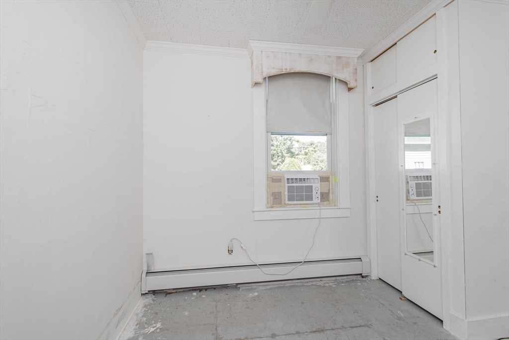 643 Center Street Raynham, MA 02767 - Photo 16 of 42 an empty room with windows