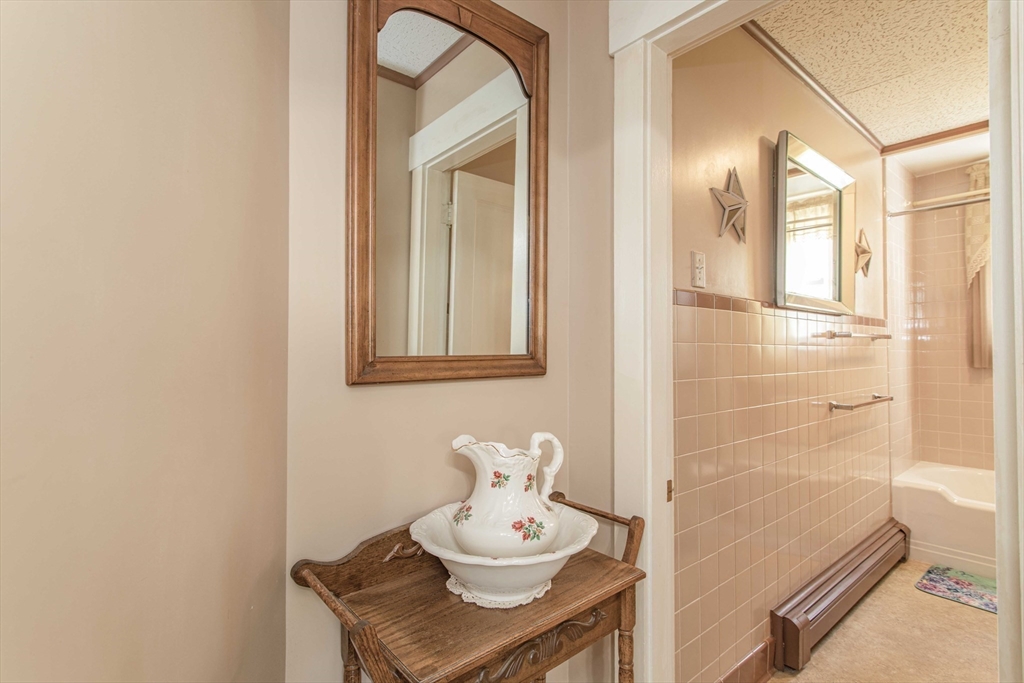 643 Center Street Raynham, MA 02767 - Photo 17 of 42 a bathroom with a sink mirror and