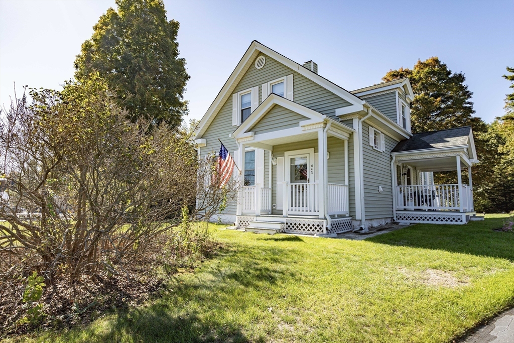643 Center Street Raynham, MA 02767 - Photo 2 of 42 a front view of a house with a yard
