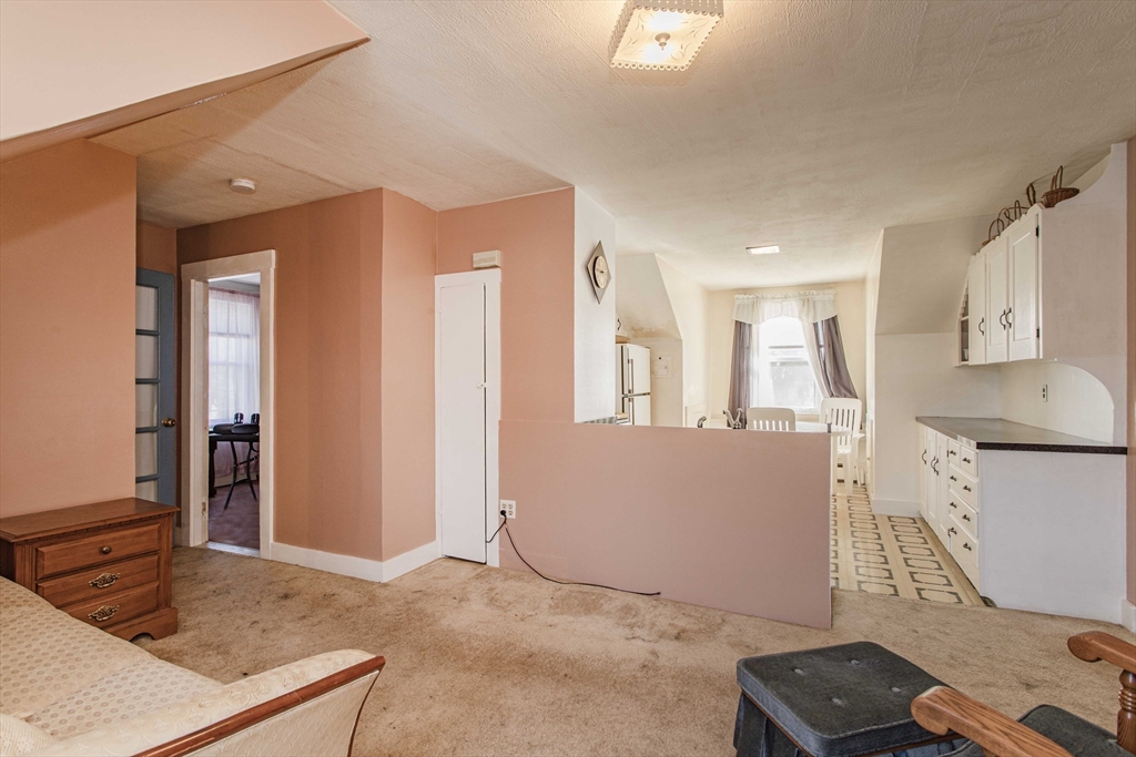 643 Center Street Raynham, MA 02767 - Photo 21 of 42 a living room with furniture and a window