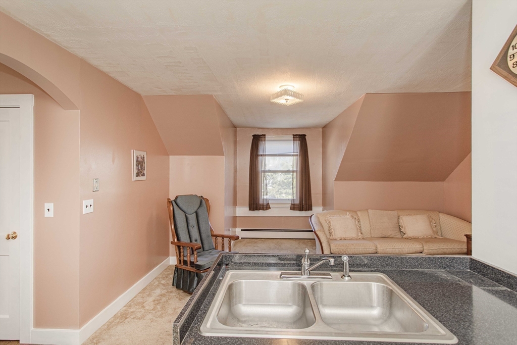 643 Center Street Raynham, MA 02767 - Photo 26 of 42 a bathroom with a sink and a tub