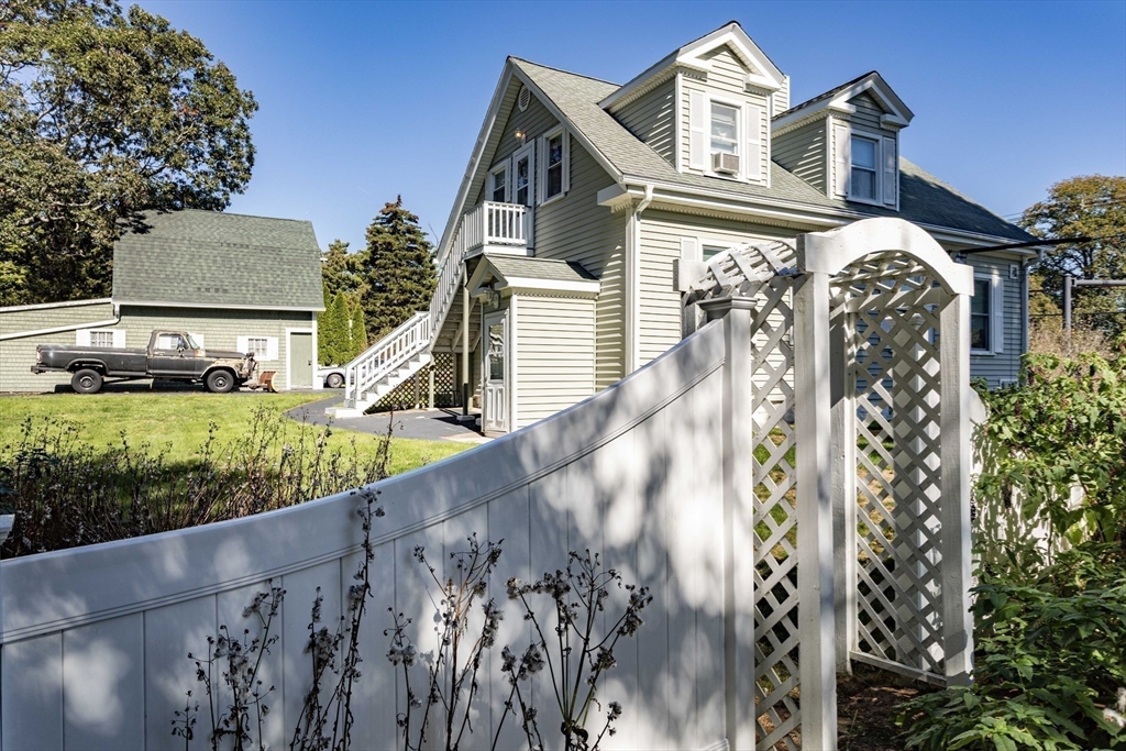 643 Center Street Raynham, MA 02767 - Photo 38 of 42 a front view of a house with a yard