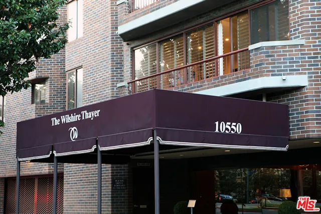 a front view of an building with retail street