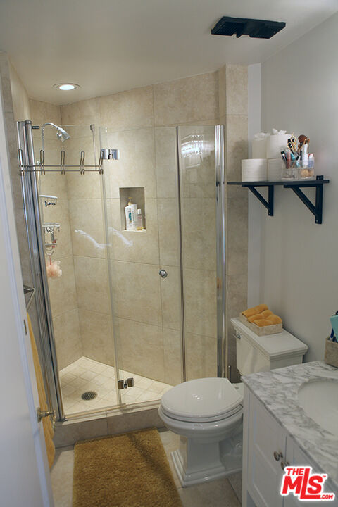 10550 Wilshire Boulevard, Unit 502 Los Angeles, CA 90024 - Photo 19 of 25 a bathroom with a toilet a sink and shower