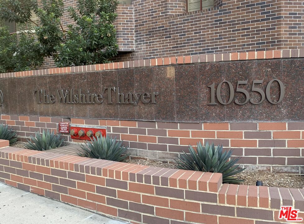 10550 Wilshire Boulevard, Unit 502 Los Angeles, CA 90024 - Photo 25 of 25 a view of outdoor space with signage and stairs
