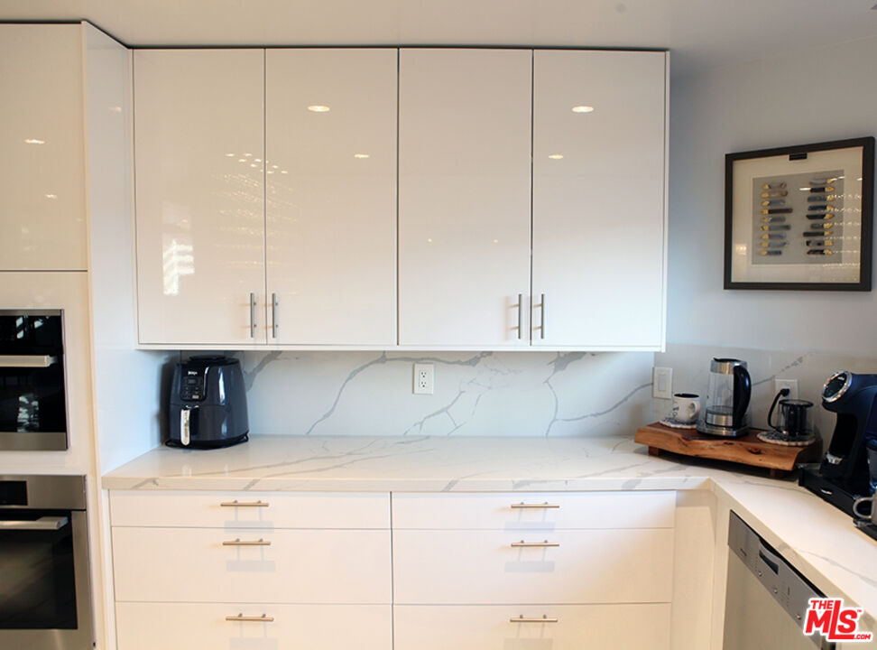 10550 Wilshire Boulevard, Unit 502 Los Angeles, CA 90024 - Photo 5 of 25 a kitchen with a sink and cabinets