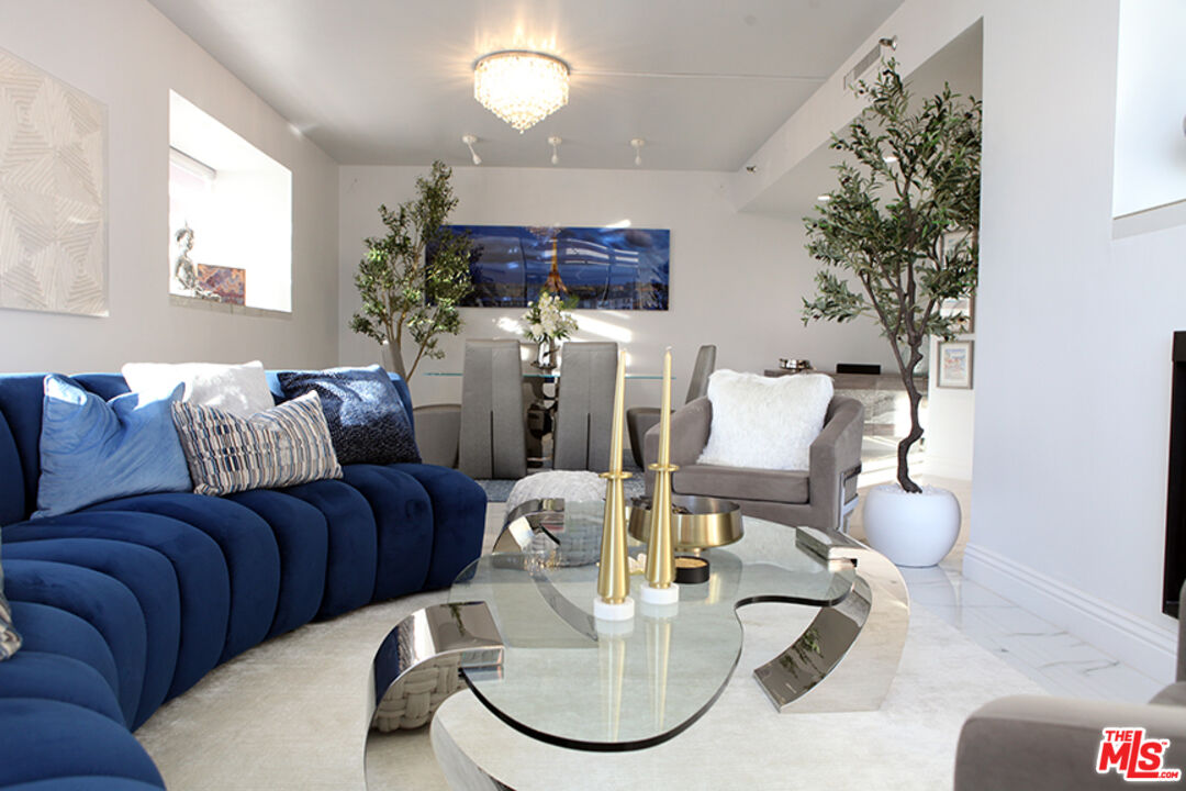 10550 Wilshire Boulevard, Unit 502 Los Angeles, CA 90024 - Photo 7 of 25 a living room with furniture fireplace and kitchen view
