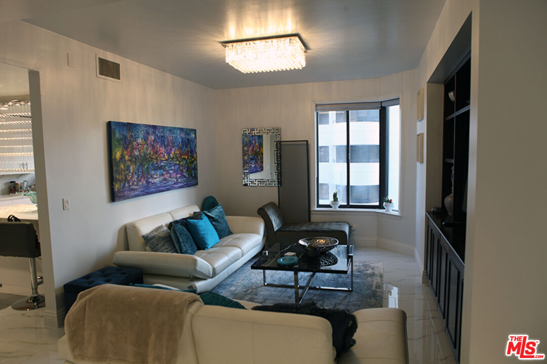 10550 Wilshire Boulevard, Unit 502 Los Angeles, CA 90024 - Photo 10 of 25 a living room with furniture and a window