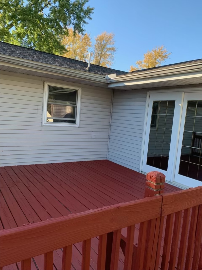 203 Ruby Street Villa Grove, IL 61956 - Photo 17 of 18 a view of a backyard with a deck and wooden floor