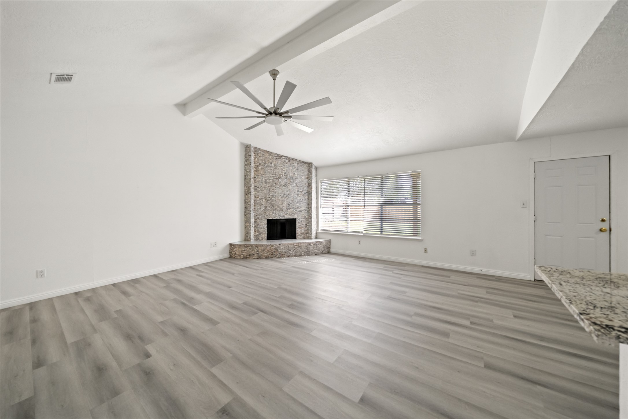 5726 Yorkgate Drive Spring, TX 77373 - Photo 5 of 20 wooden floor in an empty room with a window