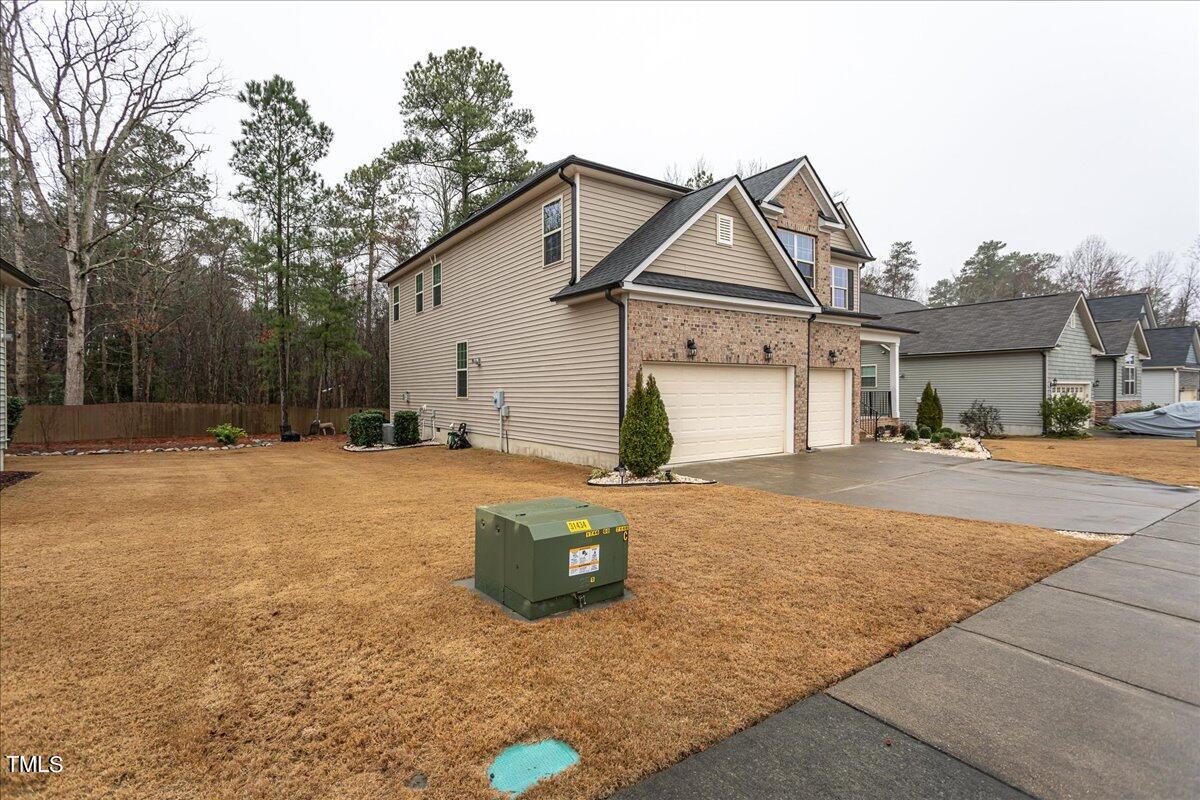 7656 Channery Way Raleigh, NC 27616 - Photo 3 of 44 Exterior Front with three car garage