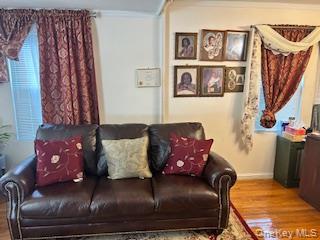 Undisclosed Address Queens, NY 11433 - Photo 4 of 7 a living room with furniture and a couch