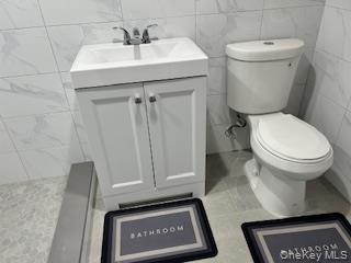 Undisclosed Address Queens, NY 11433 - Photo 5 of 7 a bathroom with a toilet and a sink