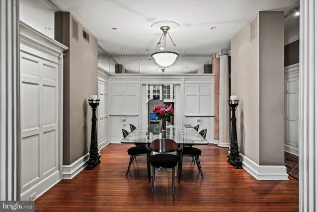 a view of a dining room with furniture wooden floor and chandelier