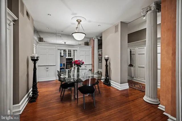a view of a dining room with furniture window and wooden floor