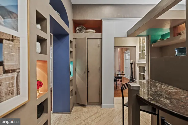 a view of a livingroom with furniture and staircase