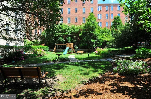 a view of a garden with a house