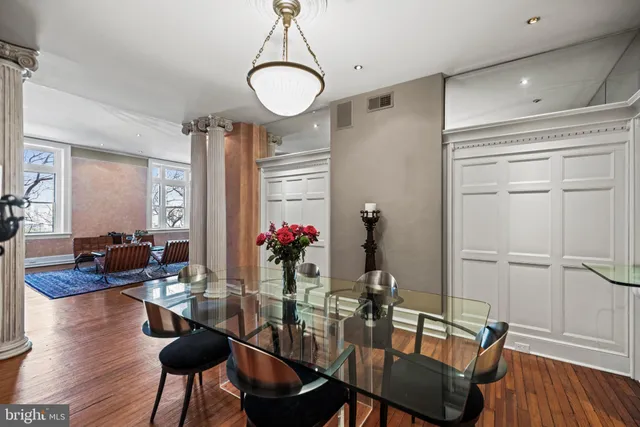 a view of a dining room with furniture and wooden floor