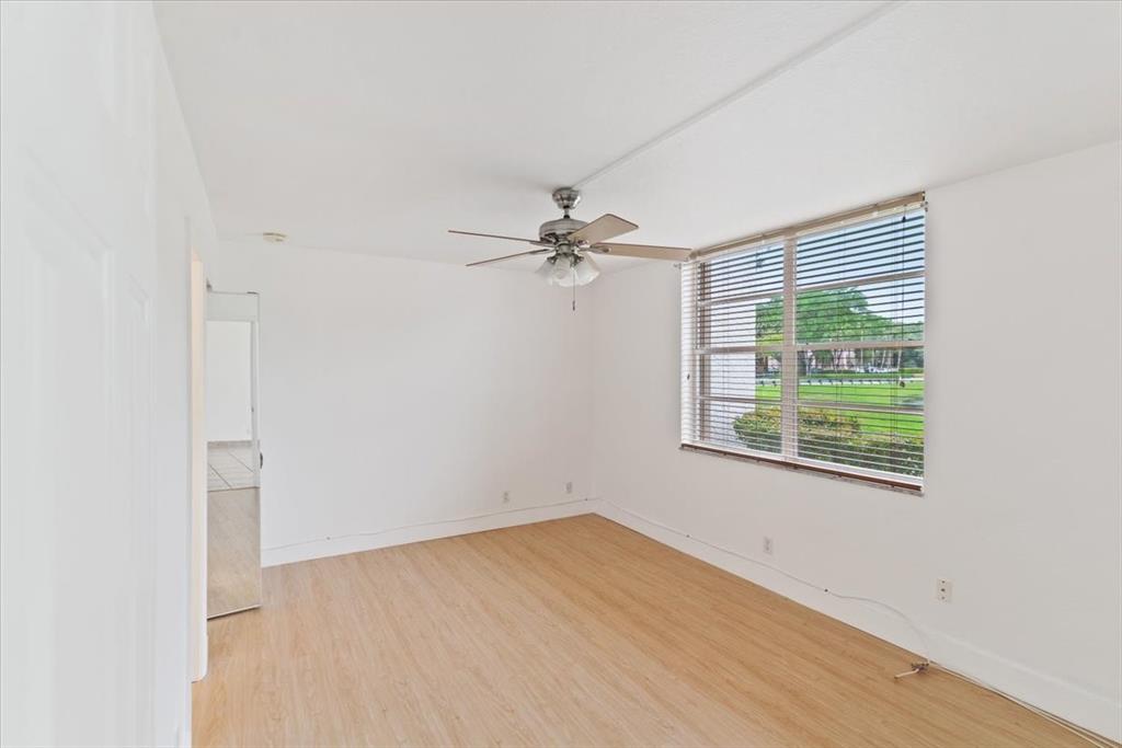 9470 Poinciana Place, Unit 103 Davie, FL 33324 - Photo 20 of 27 an empty room with a window