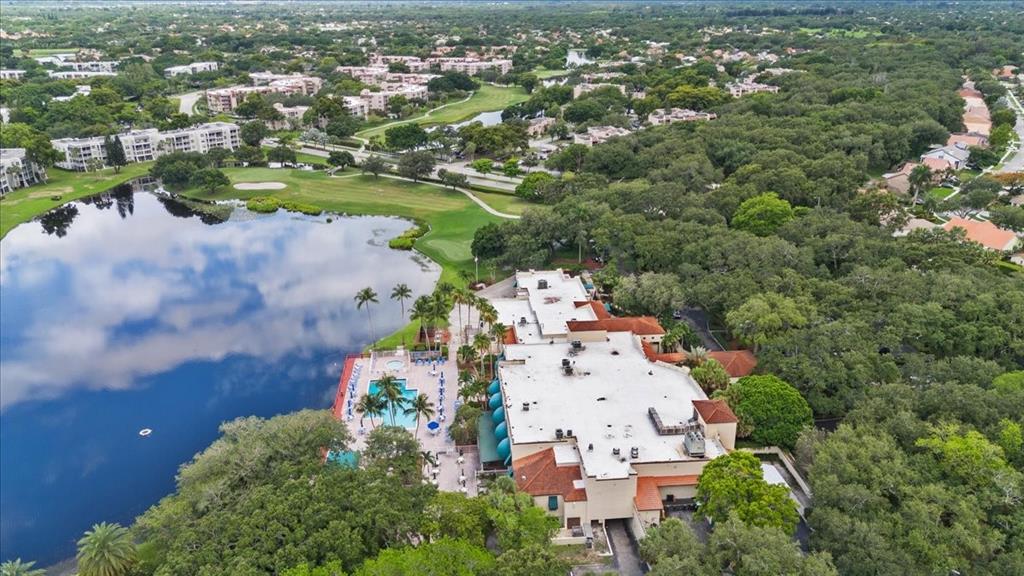 9470 Poinciana Place, Unit 103 Davie, FL 33324 - Photo 5 of 27 an aerial view of residential houses with outdoor space and trees