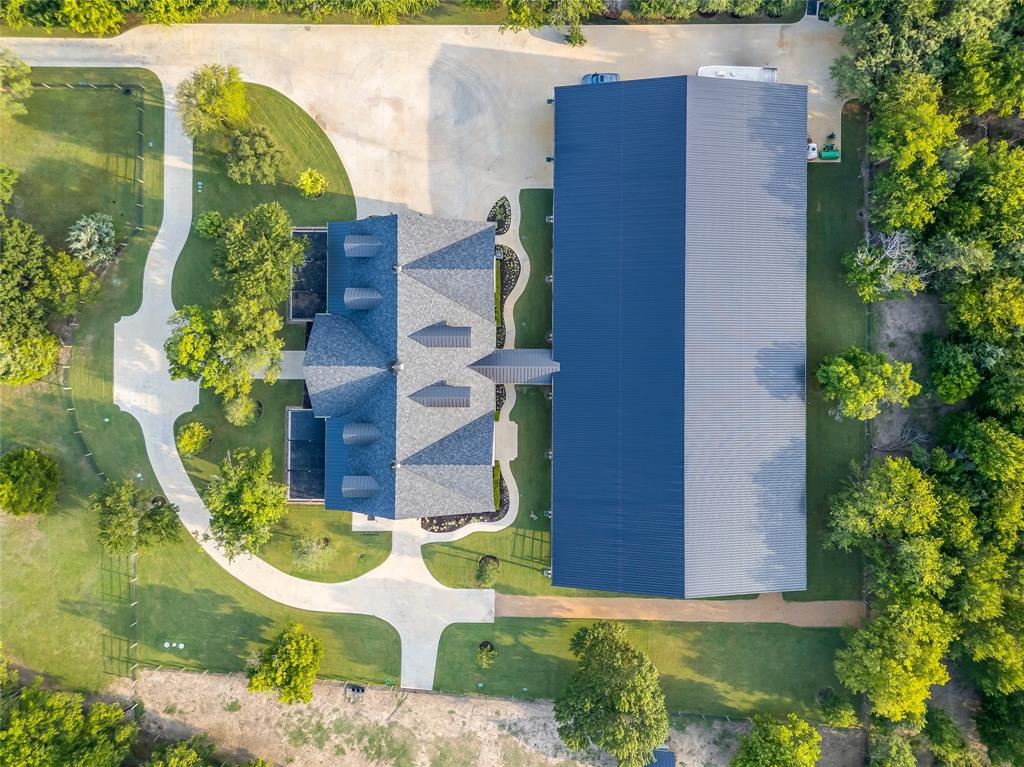 5000 T W King Road Southlake, TX 76092 - Photo 36 of 40 Strategically positioned for complete privacy, the estate offers an immersive natural retreat with secure keypad-gated access directly to the trails. from every angle — an immersive natural retreat.