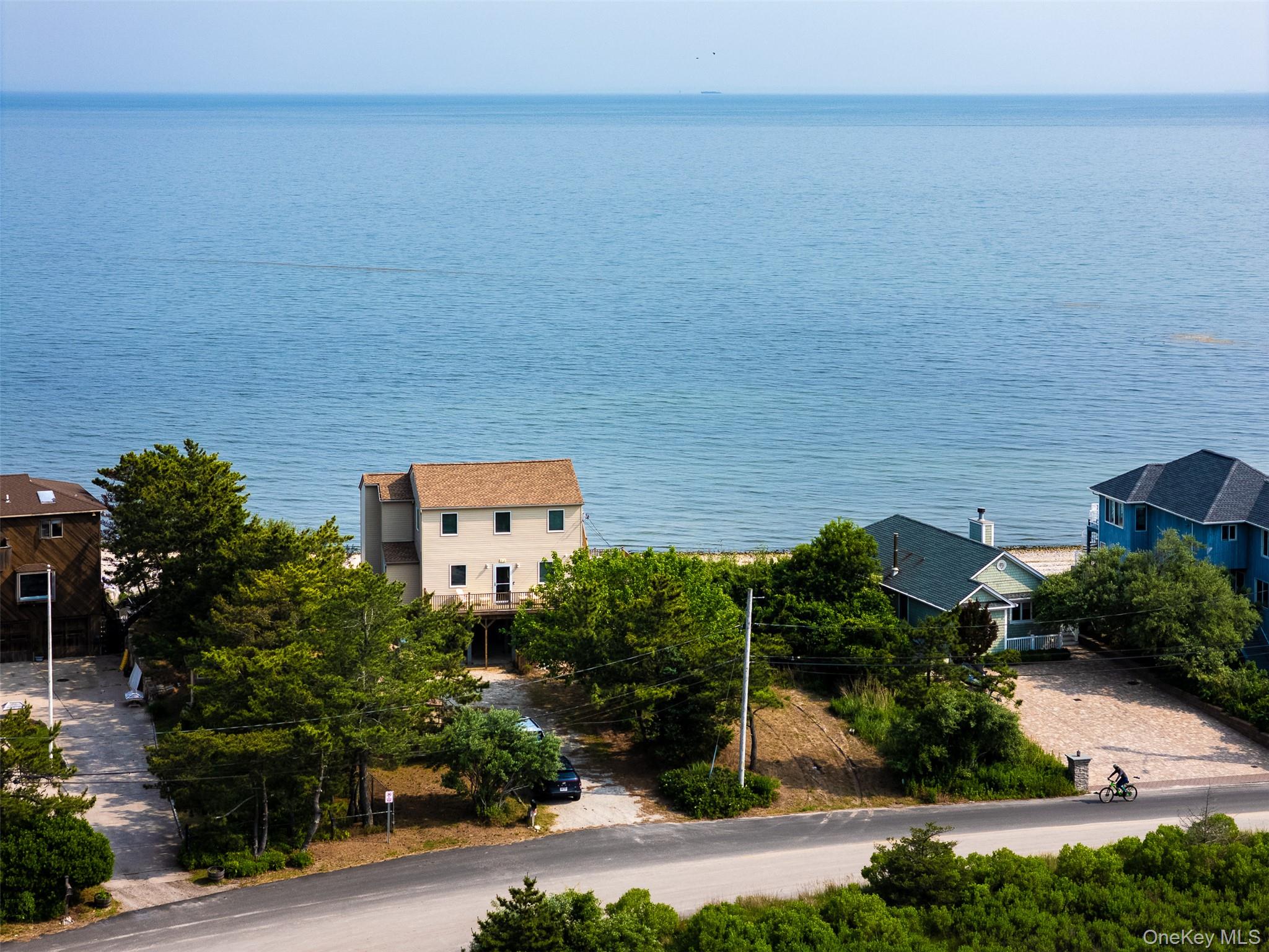 an aerial view of a house with a lake view