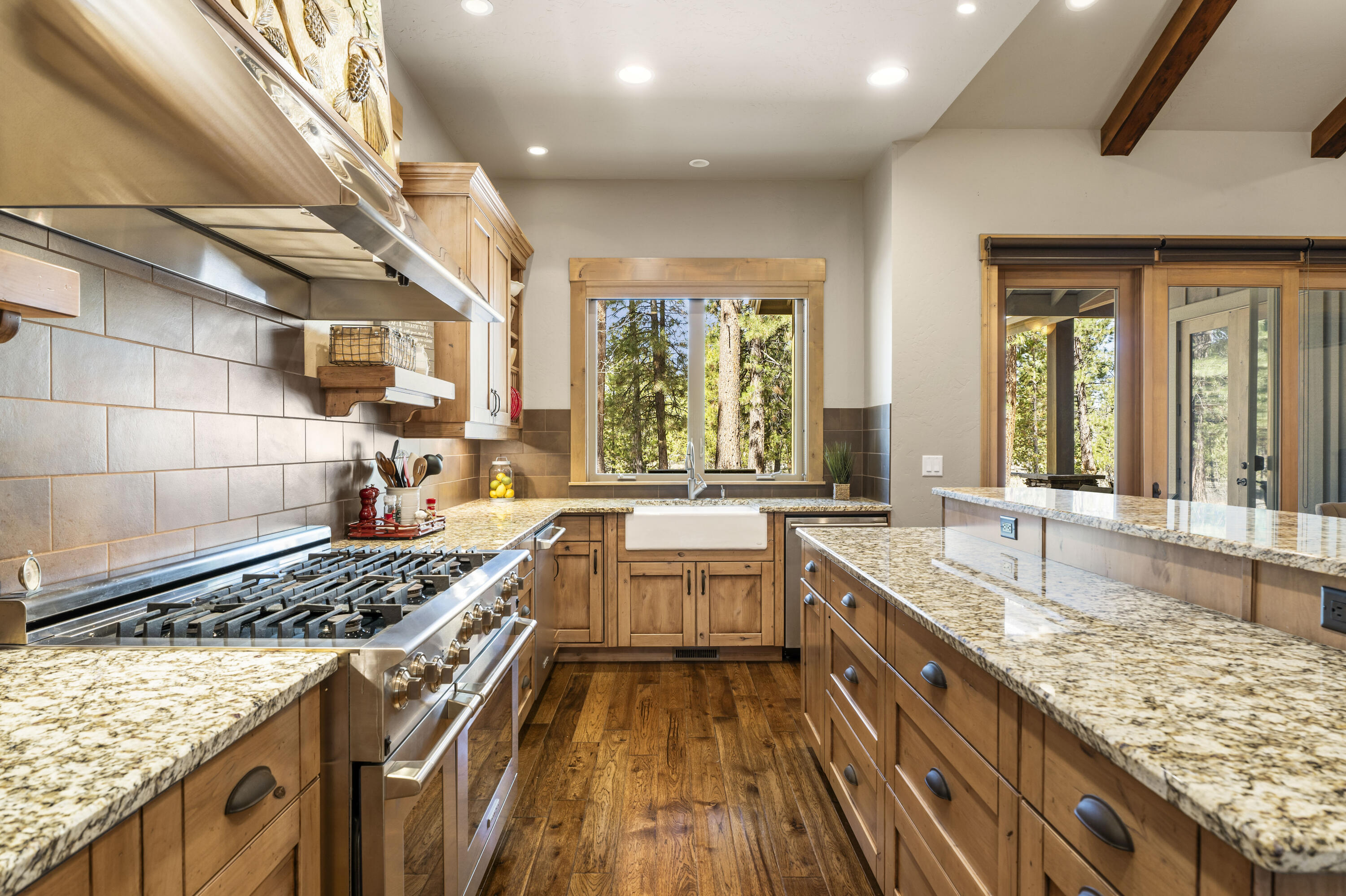 56431 Fireglass Loop, Unit 191 Bend, OR 97707 - Photo 2 of 50 The beautifully designed open kitchen showcases granite counters, a breakfast bar, and a spacious dining area.