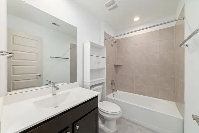 a view of a kitchen with a sink and dishwasher a refrigerator with wooden floor