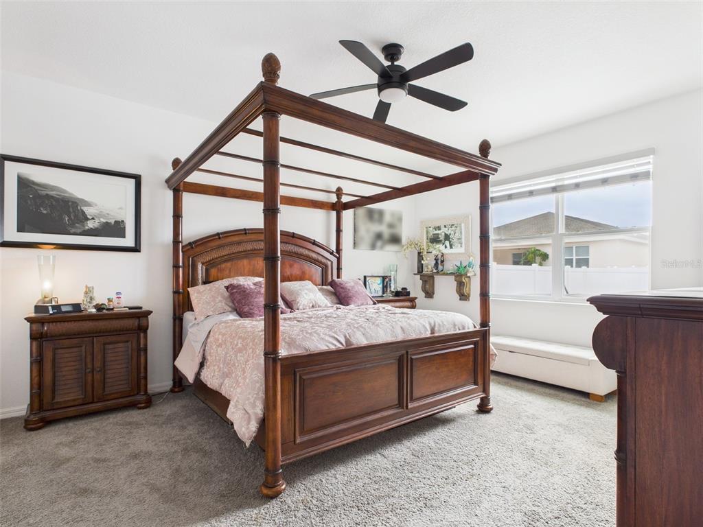 6506 Southwest 75th Ave Road Ocala, FL 34474 - Photo 19 of 28 a bedroom with a bed next to a window with the outer view