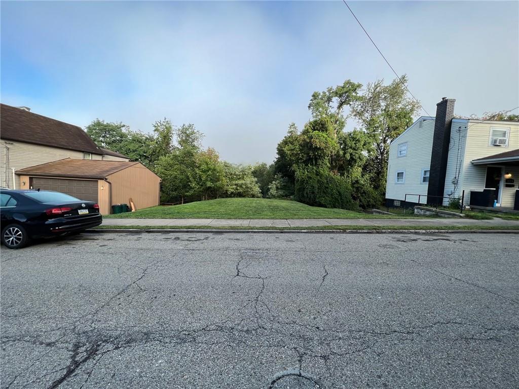 454 Edith Street Pittsburgh, PA 15211 - Photo 4 of 8 a couple of cars parked in front of a house