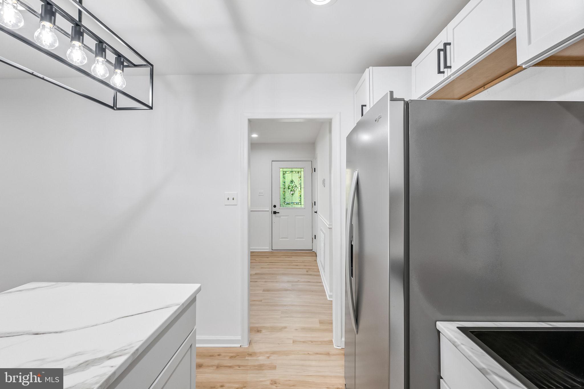 3 Boston Cove Ruther Glen, VA 22546 - Photo 17 of 30 a view of a kitchen from the hallway