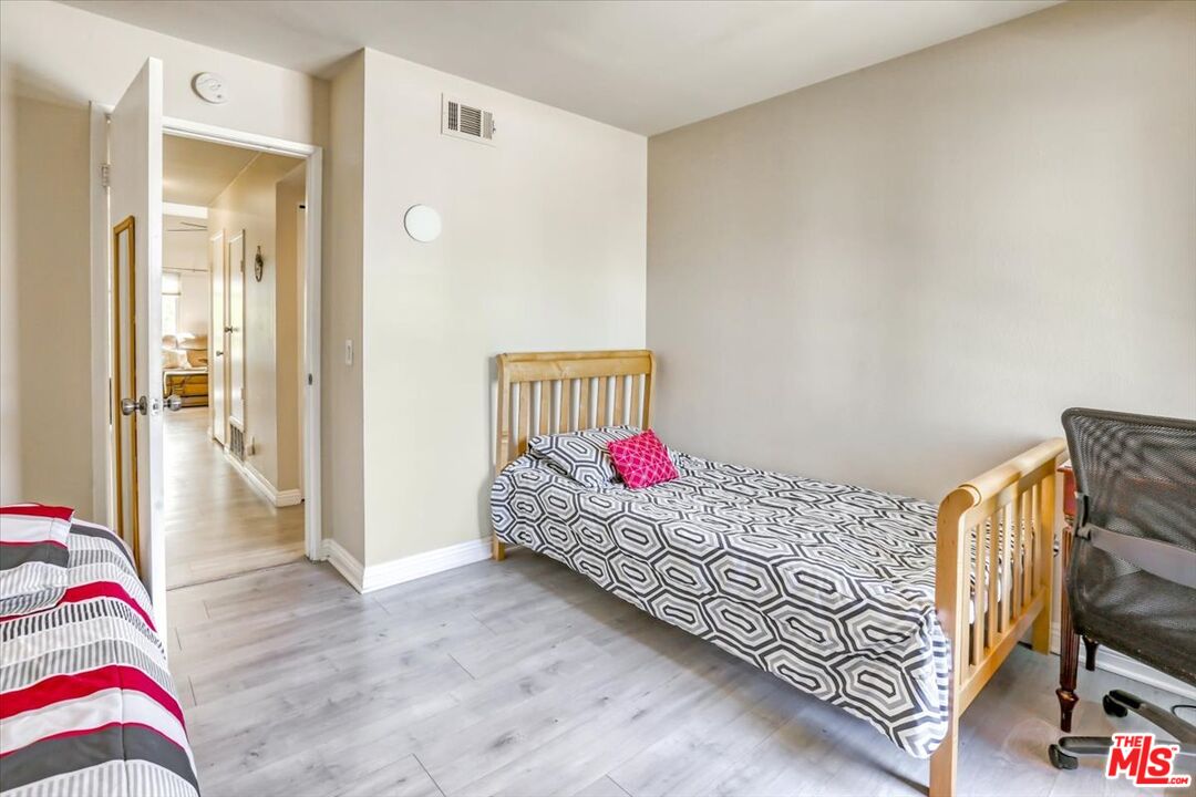 1760 Sinaloa Road, Unit 268 Simi Valley, CA 93065 - Photo 11 of 21 a bedroom with a bed and a couch
