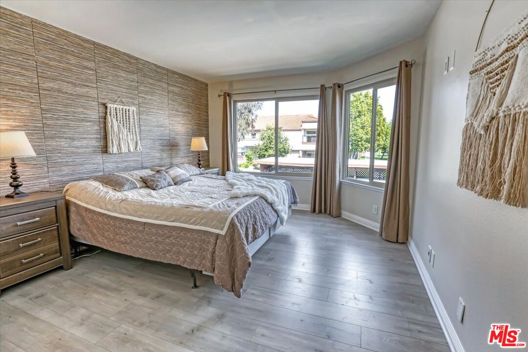 1760 Sinaloa Road, Unit 268 Simi Valley, CA 93065 - Photo 15 of 21 a bedroom with a bed and wooden floor