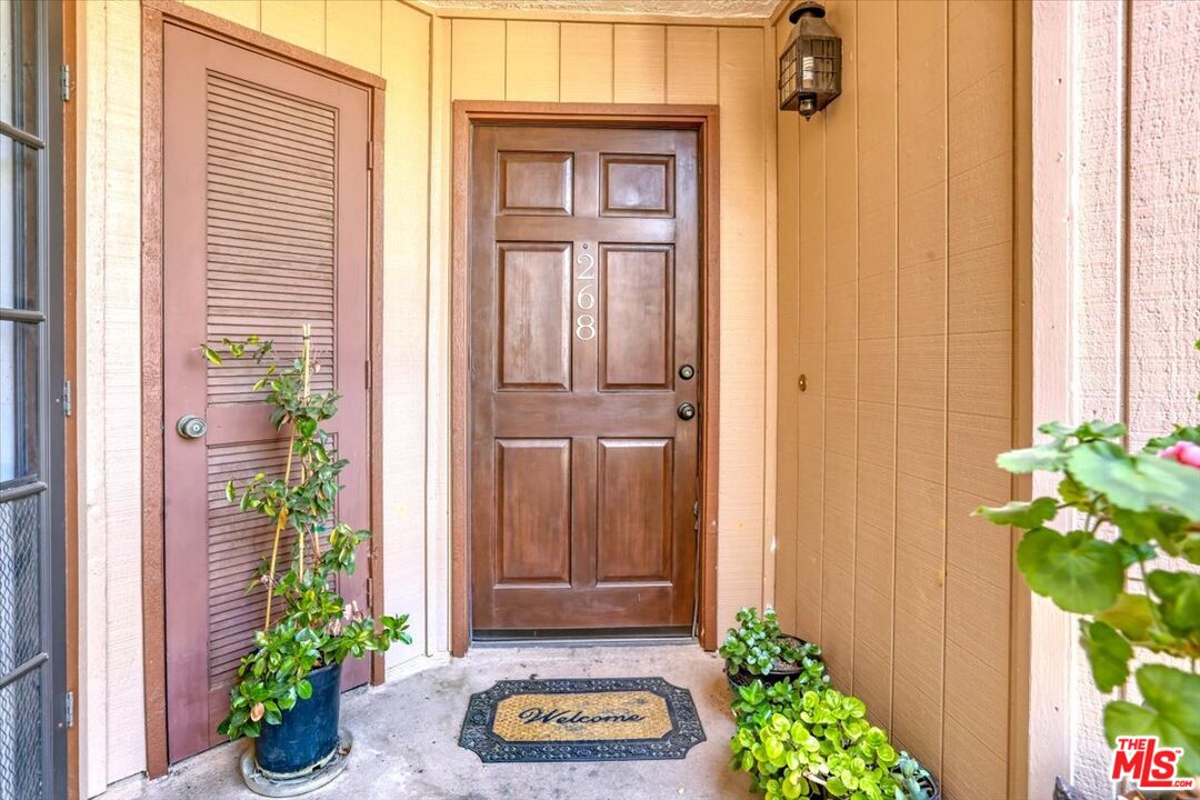 1760 Sinaloa Road, Unit 268 Simi Valley, CA 93065 - Photo 3 of 21 a front view of a house with a garden