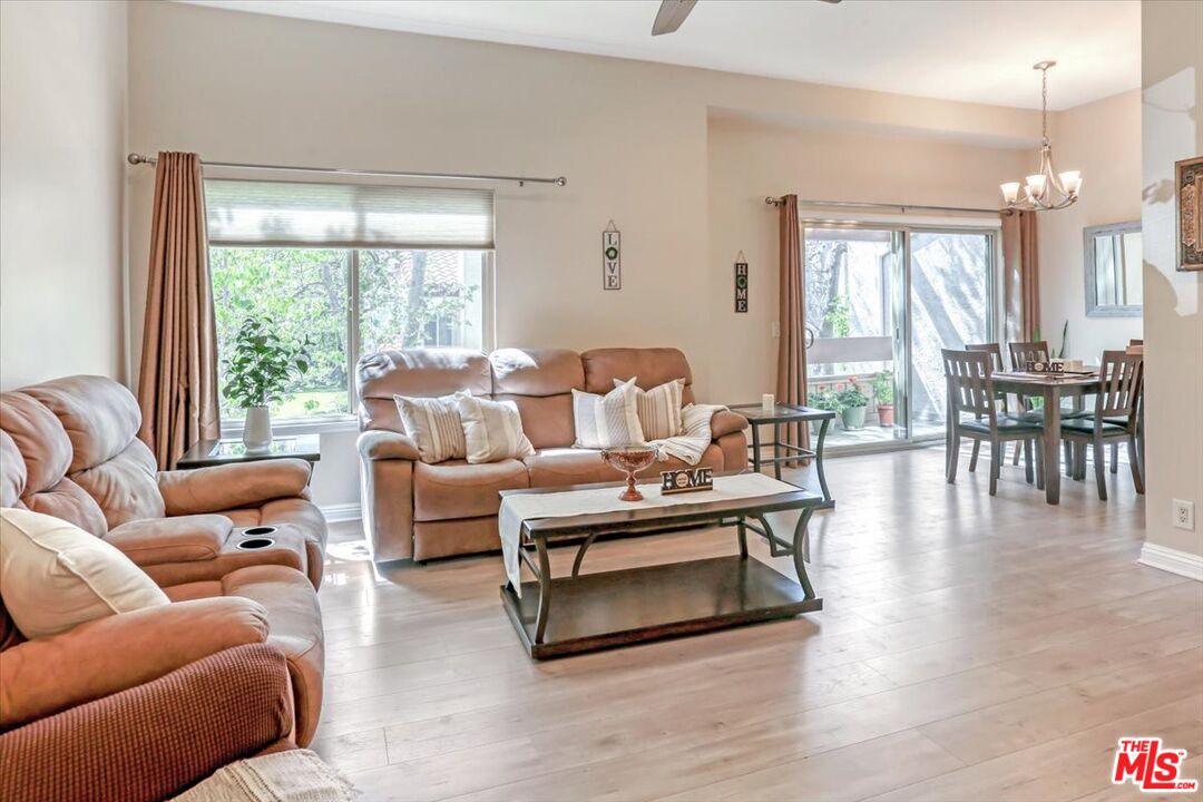 1760 Sinaloa Road, Unit 268 Simi Valley, CA 93065 - Photo 4 of 21 a living room with furniture wooden floor and a large window