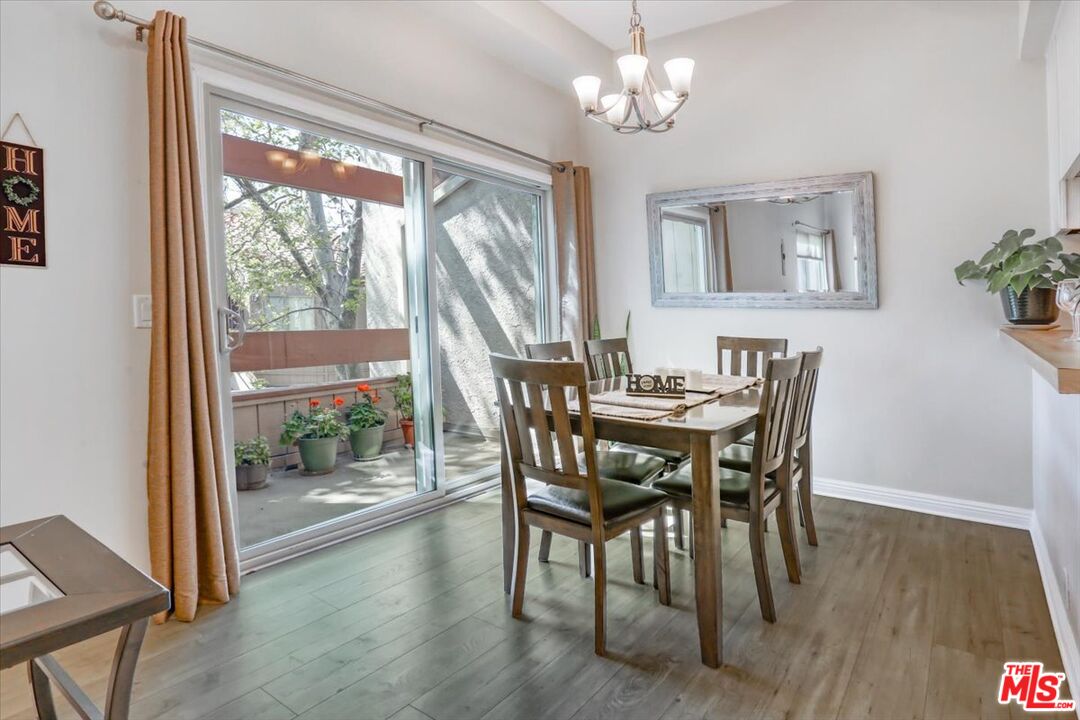 1760 Sinaloa Road, Unit 268 Simi Valley, CA 93065 - Photo 5 of 21 a view of a dining room with furniture window and wooden floor