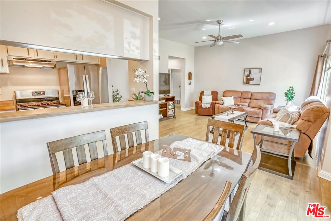 1760 Sinaloa Road, Unit 268 Simi Valley, CA 93065 - Photo 6 of 21 a living room with furniture wooden floor and a table