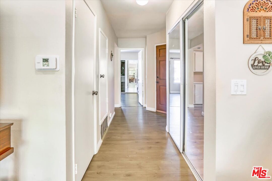 1760 Sinaloa Road, Unit 268 Simi Valley, CA 93065 - Photo 10 of 21 a view of a hallway with wooden floor and a bathroom