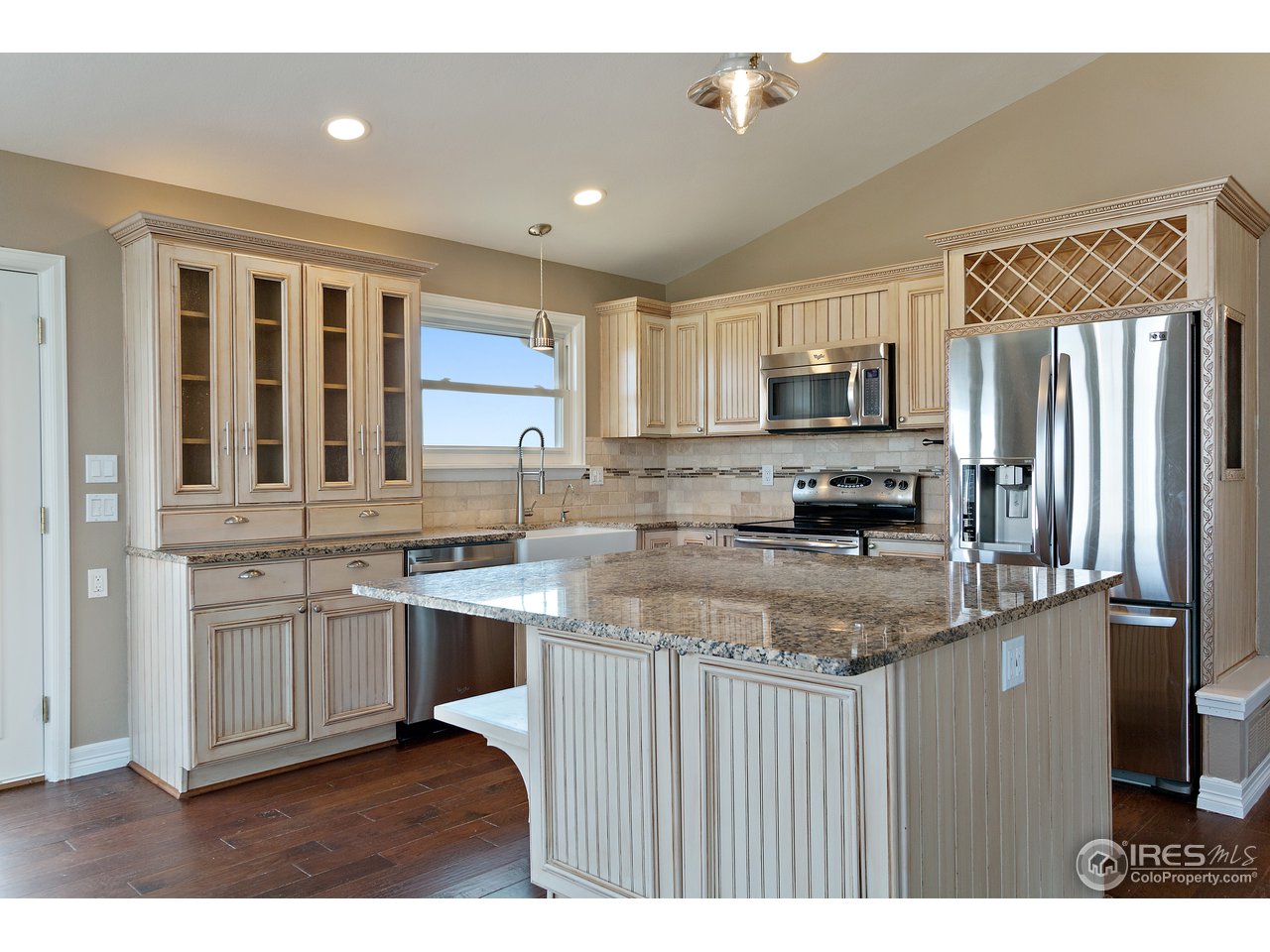 9088 North Awl Road Parker, CO 80138 - Photo 11 of 40 a kitchen with stainless steel appliances granite countertop a stove a sink dishwasher a refrigerator and a oven