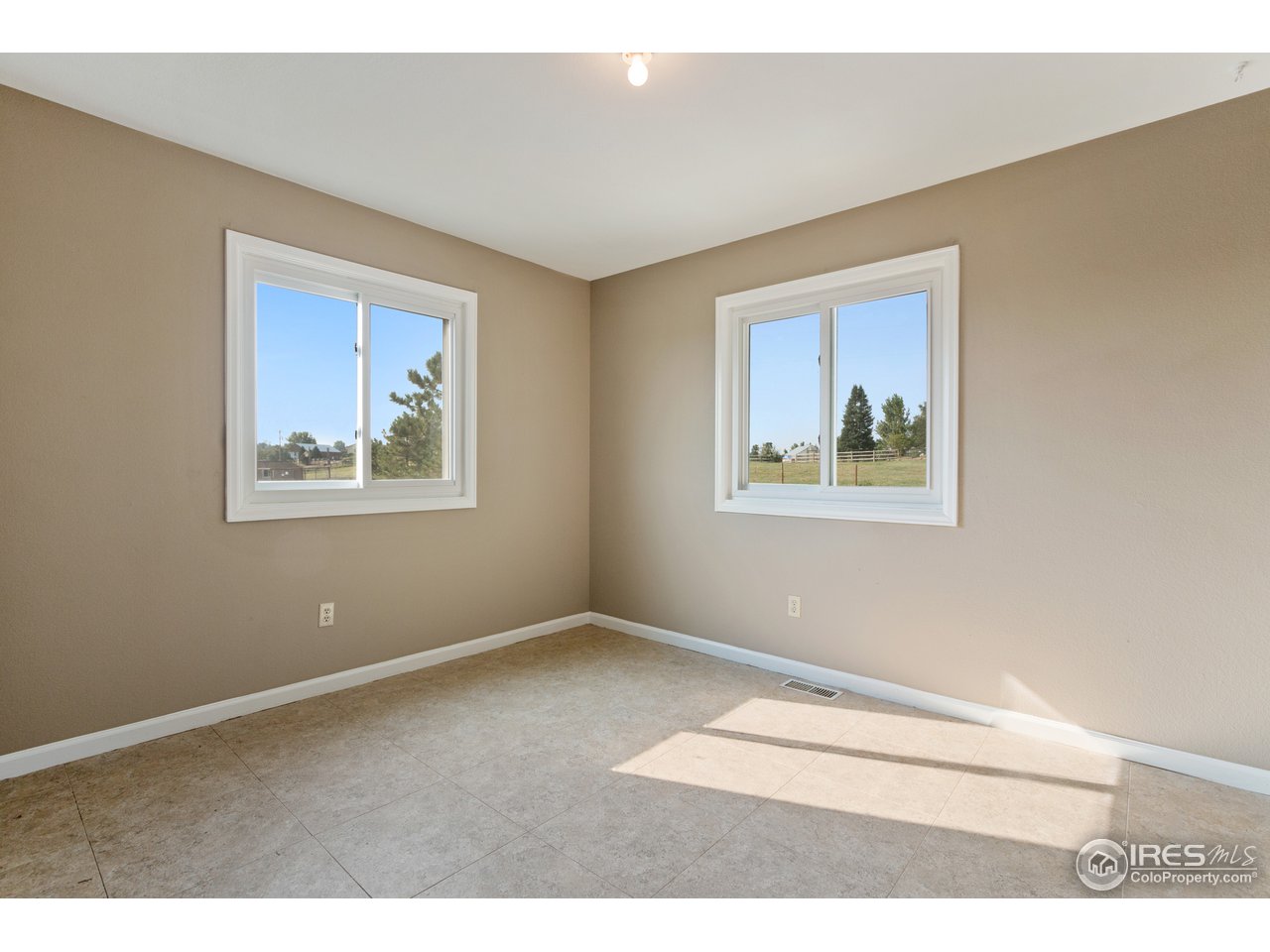 9088 North Awl Road Parker, CO 80138 - Photo 19 of 40 a view of an empty room with window